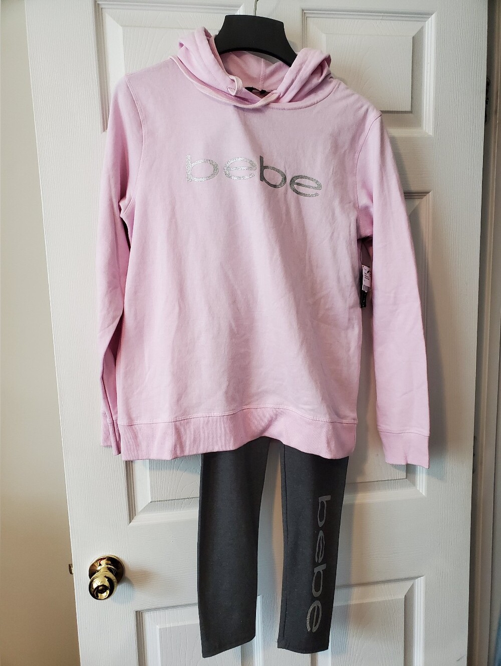 bebe Light Pink Hooded Sweatshirt with Silver Logo